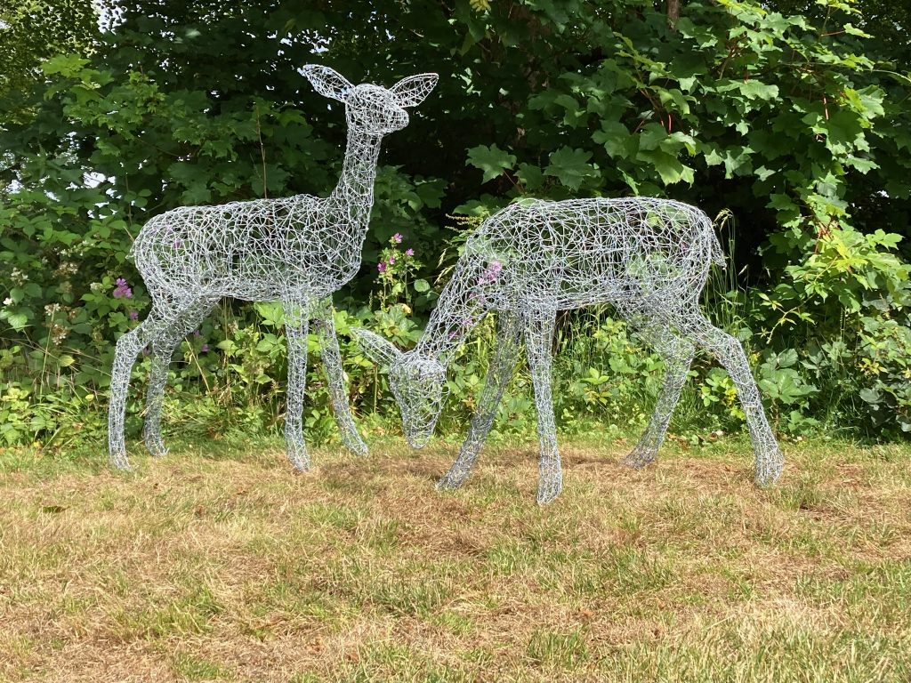 Pair of wire deer sculptures